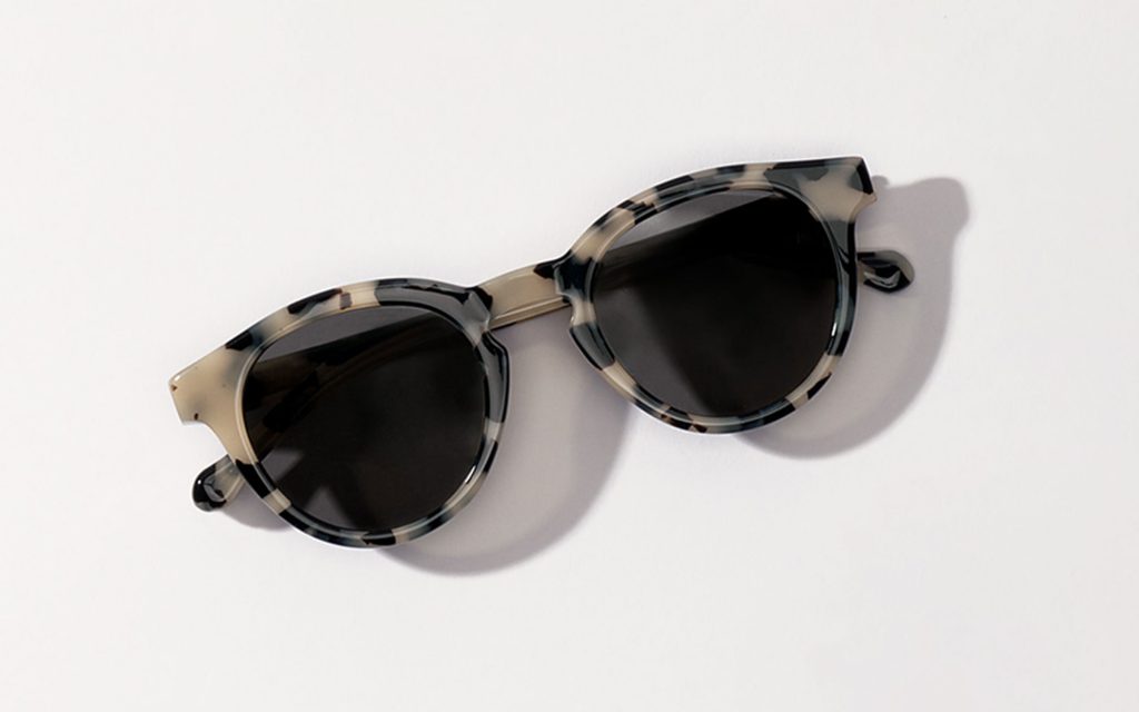 Ivory tortoise sunglasses on white background
