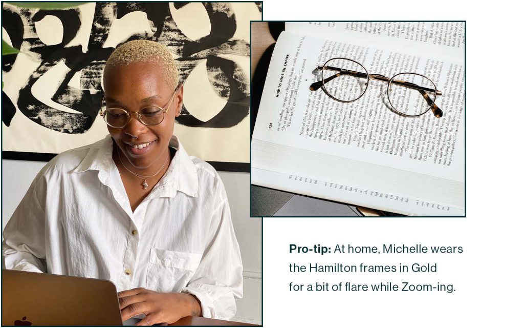 model wears gold glasses gold glasses rest on top of book