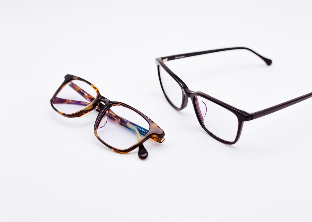 Two pairs of Felix Gray eyeglasses on white background