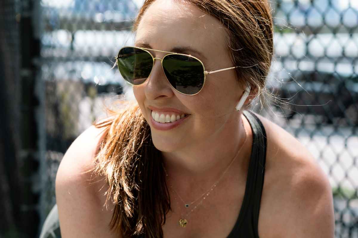 women wearing sunglasses outdoors in a park working out, polarized sunglasses