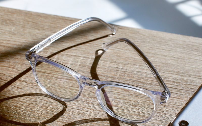 Crystal Clear Roebling glasses on a wooden table with a phone