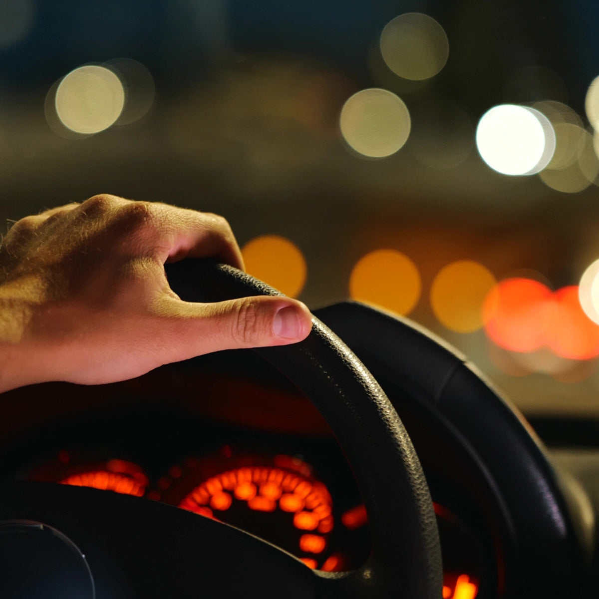 Man driving at night lights reflecting