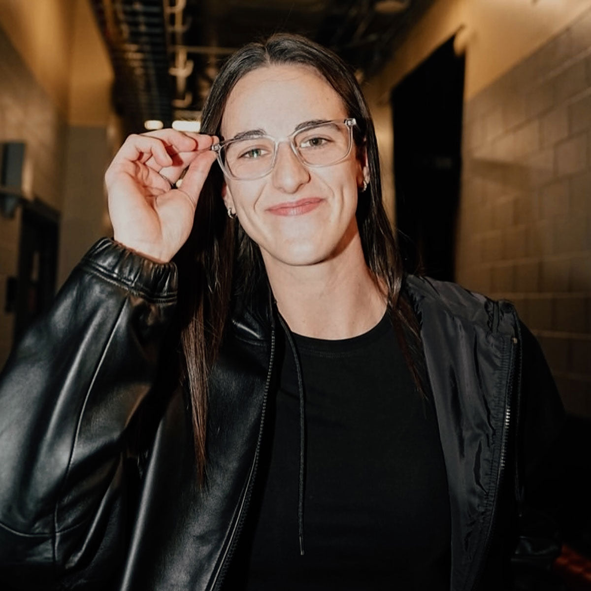 WNBA Caitlin Clark wearing blue light glasses before the game