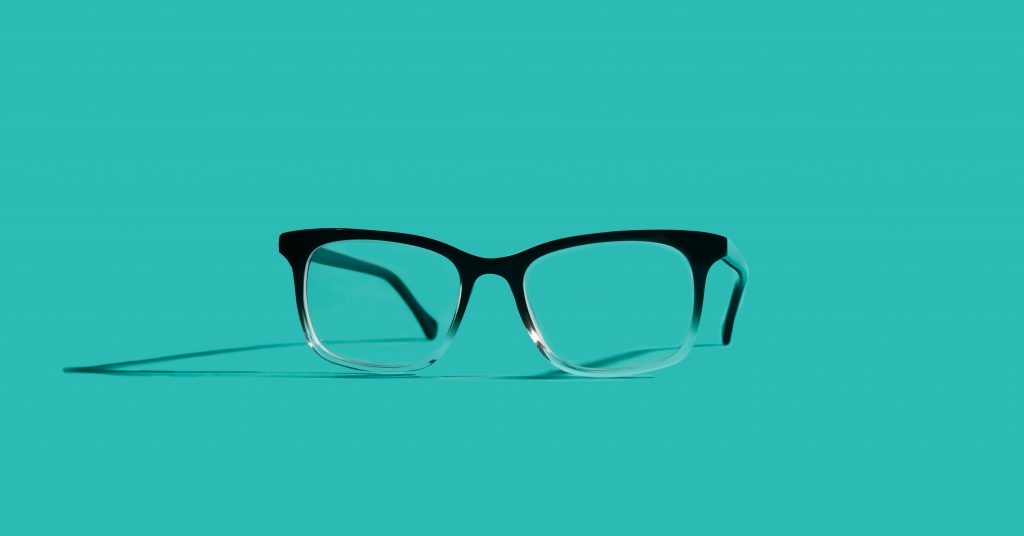 Felix Gray Hopper eyeglasses on a teal background