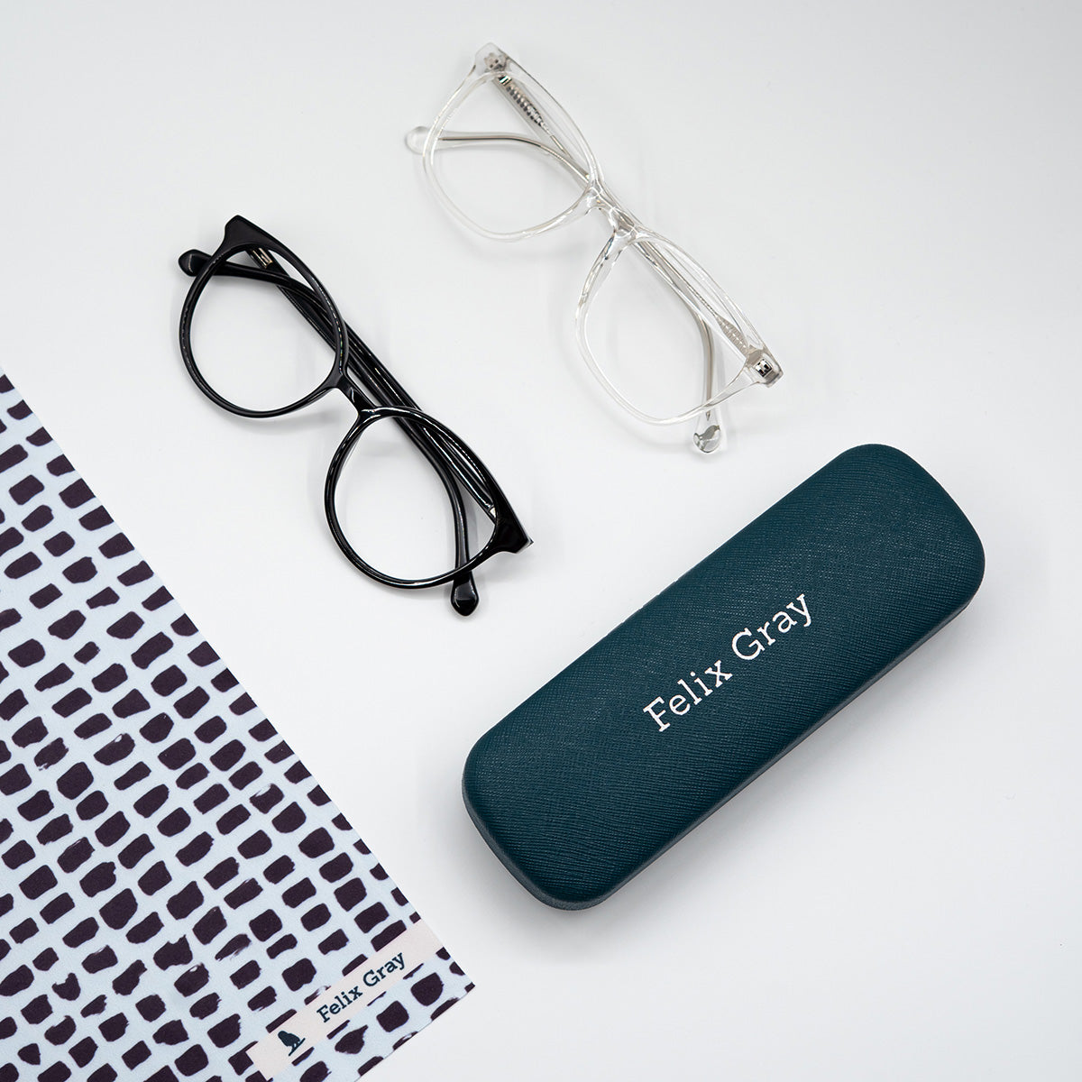 Black and clear glasses with hard case and cleaning cloth
