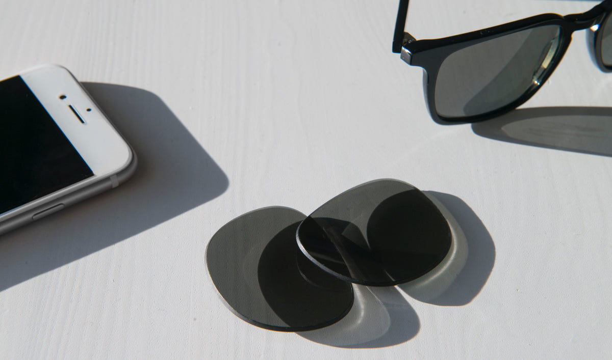 Sunglasses and lens on a table