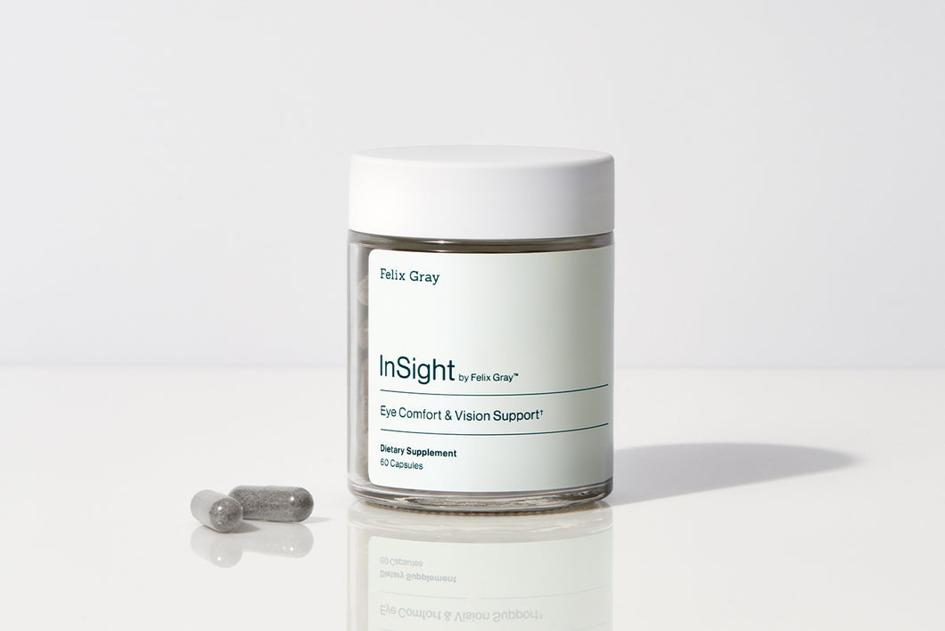 InSight supplement jar and two capsules sitting on table